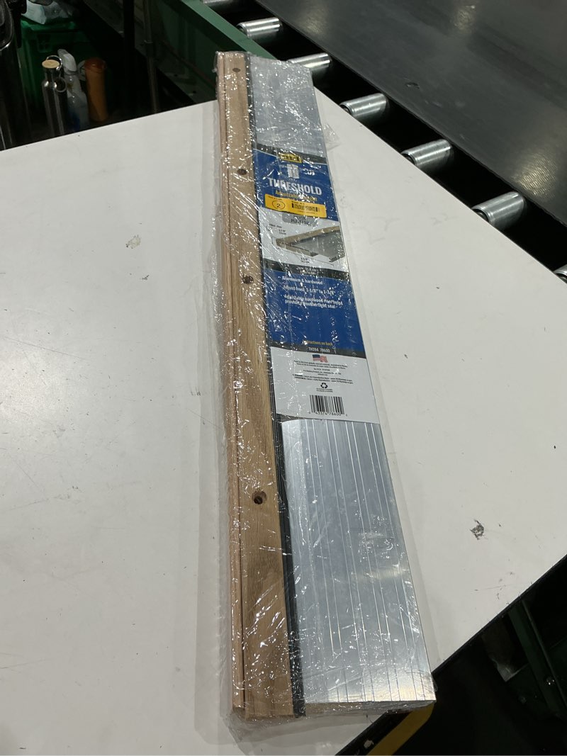 Condition photo showing Good Condition for m-d building products 1.13 in. h x 5.63 in. w x 36 in. l aluminum adjustable threshold oak