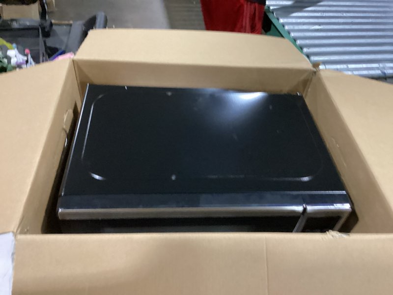 Condition photo showing As Is for black+decker em720cb7 digital microwave oven with turntable push-button door, child safety lock, 700w, stainless steel, 0.7 cu.ft 0.7 cu. ft.