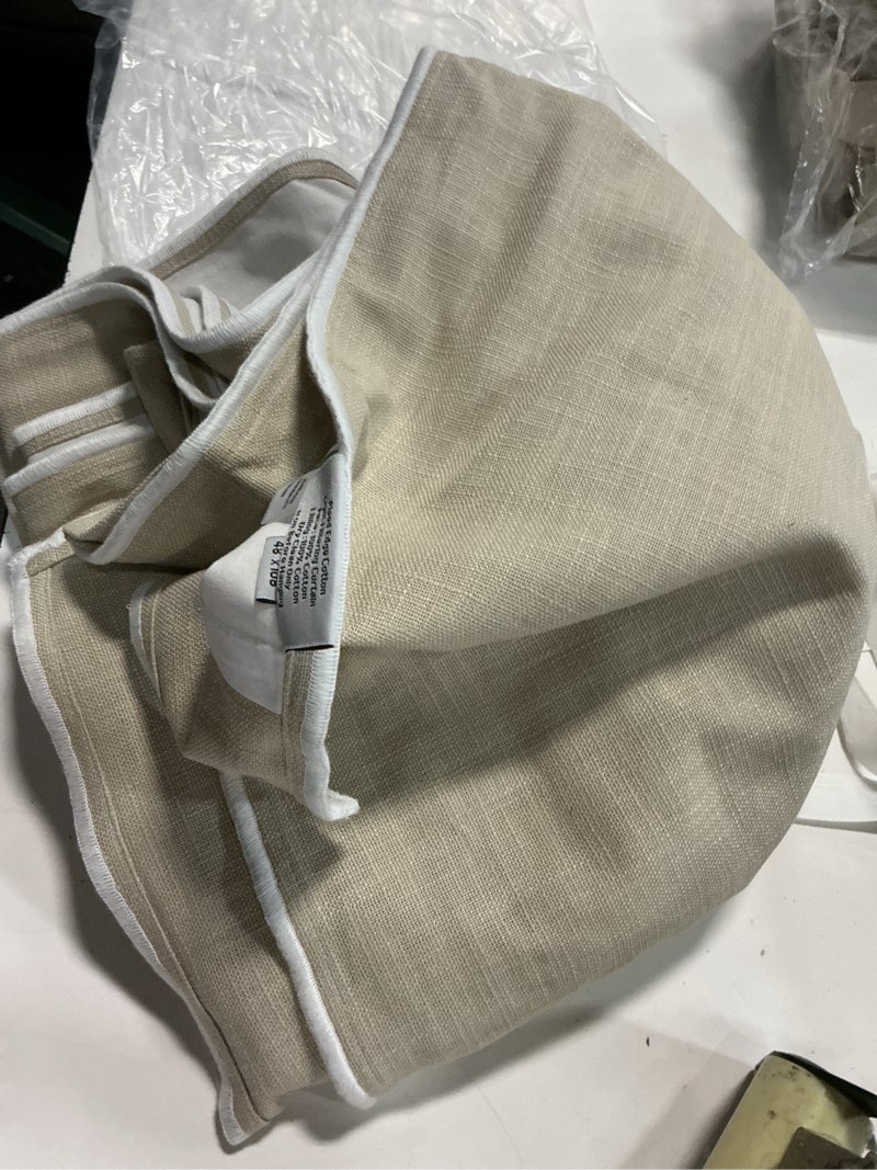 Condition photo showing Good Condition for piped edge cotton true blackout curtain - single panel color: ivory/oatmeal piping doublure: true blackout size: 48x108