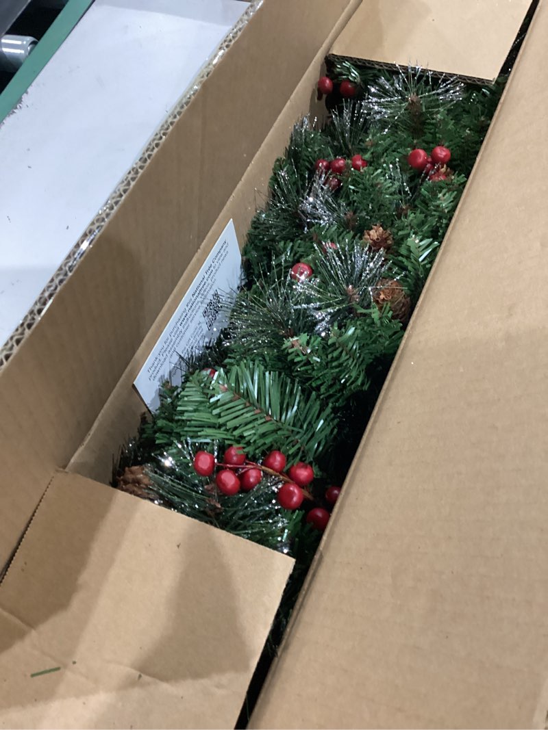 Condition photo showing Good Condition for national tree company 9 ft pre-lit crestwood spruce artificial christmas garland, christmas decoration with glitter, pinecones, red berries, 50 clear lights, 180 tips, green plug in tree