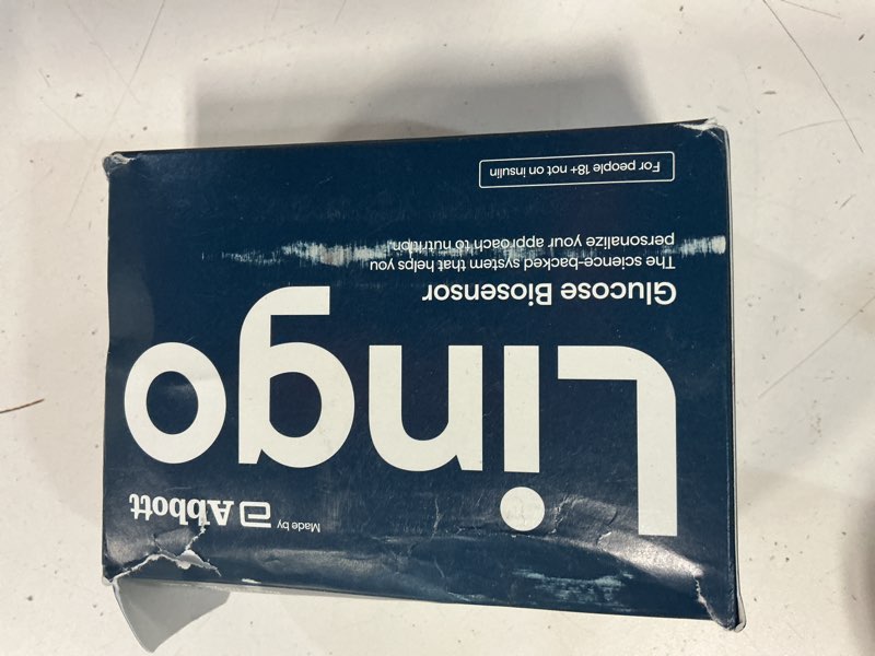 Condition photo showing New/Like New for lingo continuous glucose monitor (cgm). made by abbott. optimize your nutrition with real-time glucose data & insights. 1 lingo biosensor lasts up to 14 days*. works with ios and android. us only.