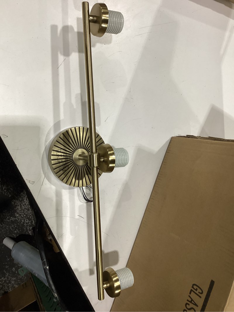 Condition photo showing New/Like New for kichler brianne 24.5 inch 3 light vanity light with satin etched cased opal glass in brushed natural brass 3-light brushed natural brass