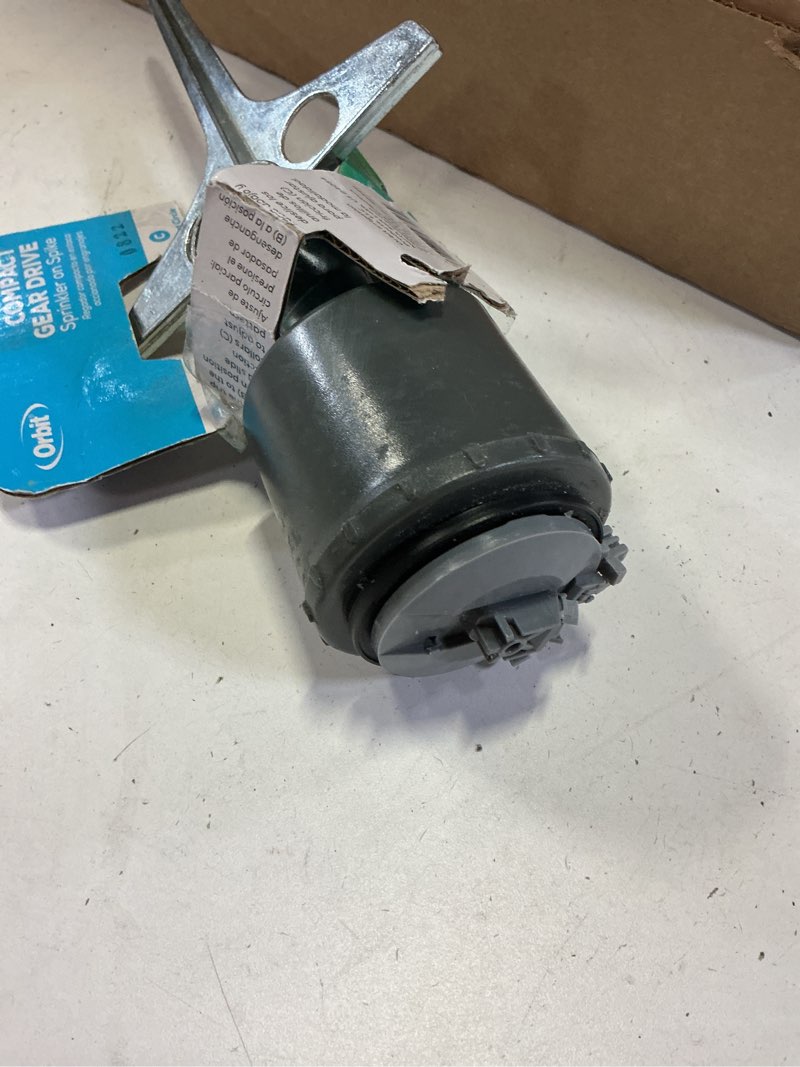 Condition photo showing As Is for orbit 5000-sq ft rotating spike lawn sprinkler