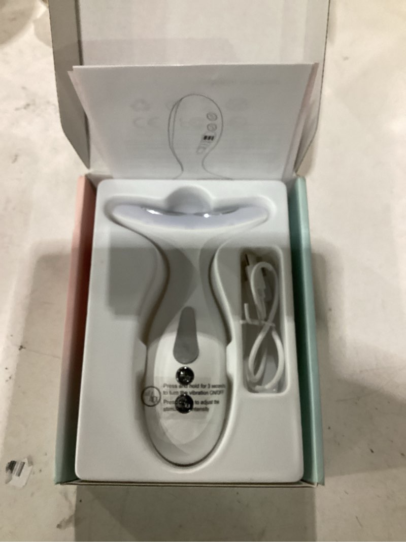 Condition photo showing Good Condition for neck massager — portable facial/neck massager with constant temperature heat therapy and vibration massage. usb rechargeable, three adjustable speeds. relieves fatigue and aids in skincare absorption medium white