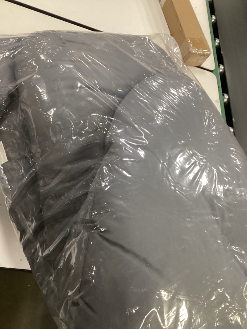 Condition photo showing As Is for Grey outdor patio cushion