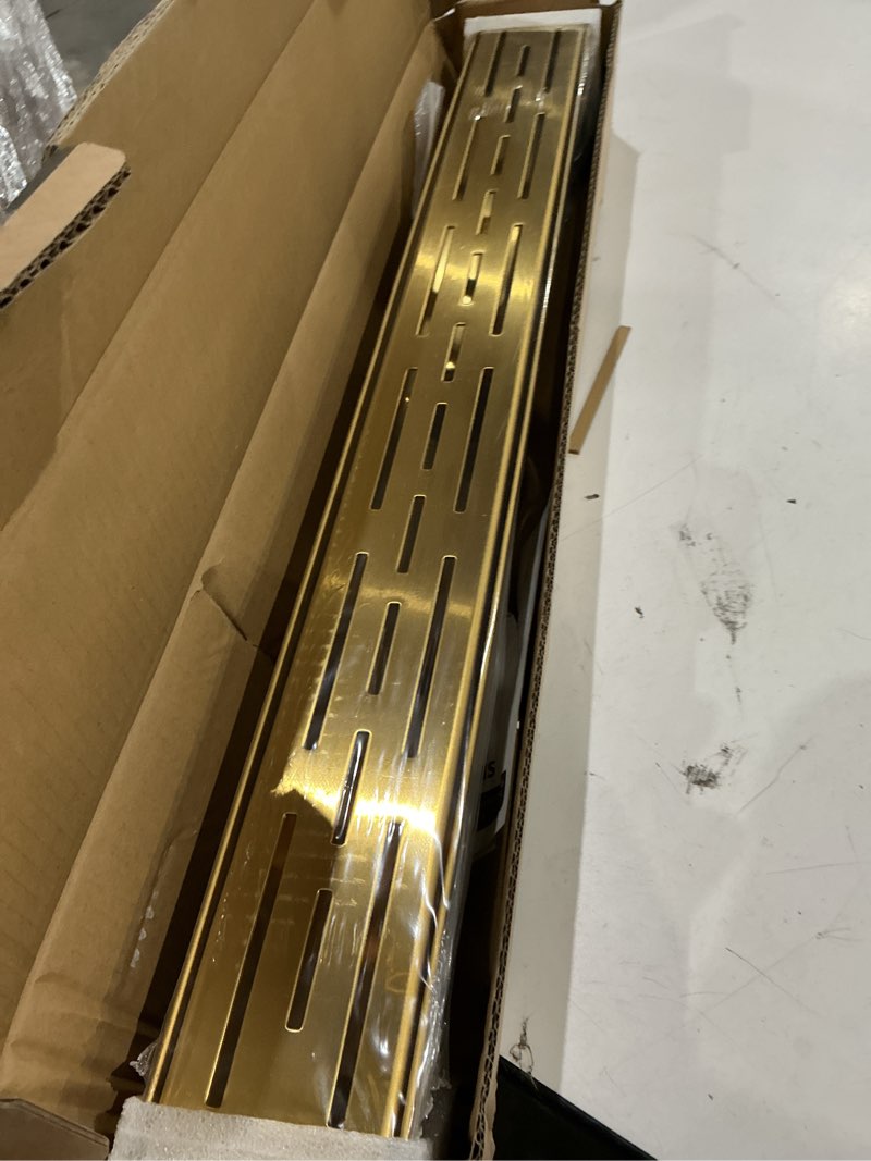 Condition photo showing Good Condition for brushed titanium gold shower drain 24 inch, 304 stainless steel linear shower drain with removable brick pattern grate - adjustable rectangular shower floor drain with hair strainer, linear drain brushed titanium gold 24 inch