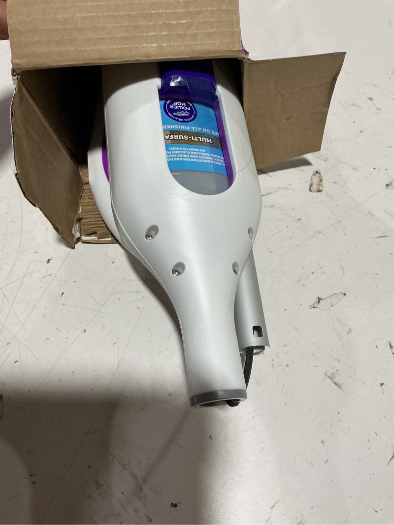 Condition photo showing As Is for swiffer powermop multi-surface mop kit for floor cleaning, includes powermop, 2 mopping pad refills, 1 cleaning solution with fresh scent and 2 batteries purple and white