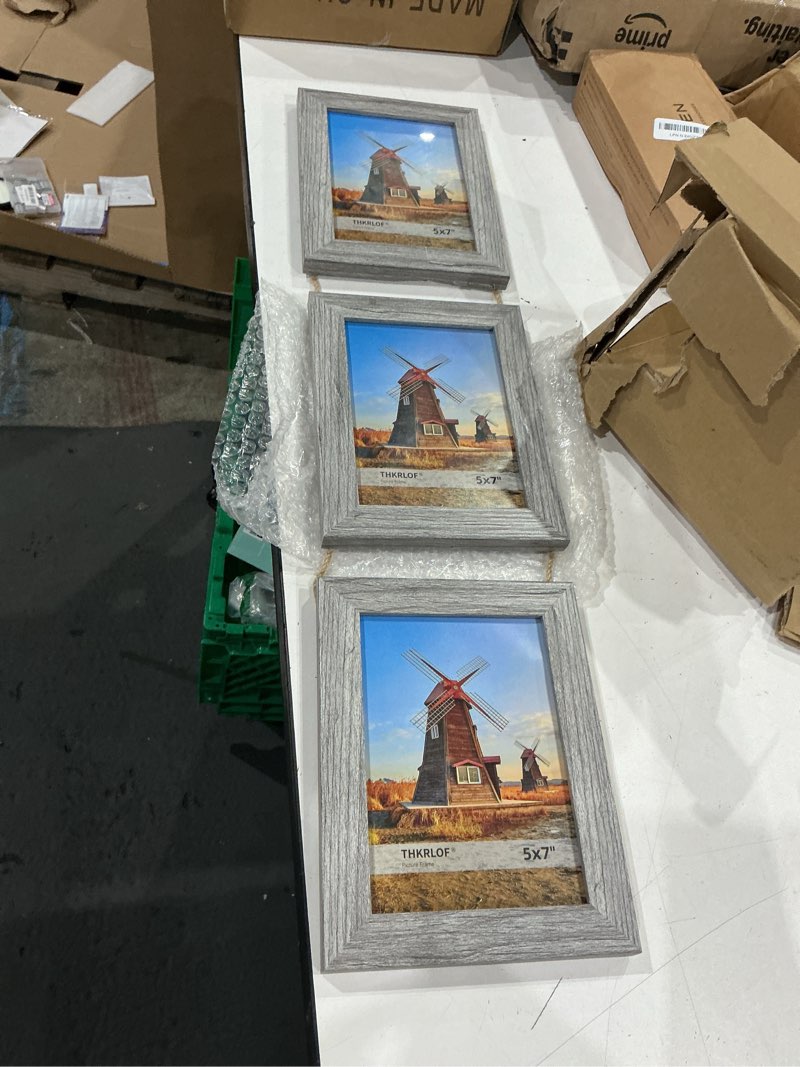 Condition photo showing As Is for 5x7 picture frames collage, real glass wooden vertical hanging 3 opening 5 by 7 photo frame, grey, 1 pack
