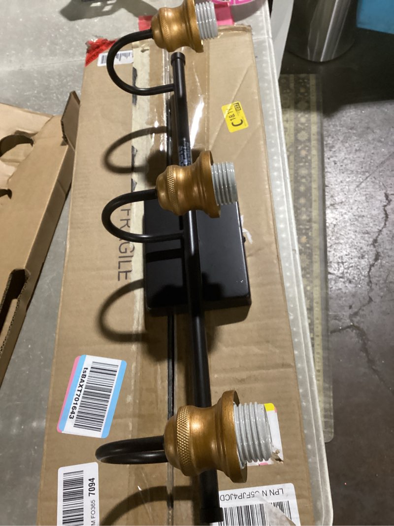 Condition photo showing As Is for Tipace Black & Gold Vintage Bathroom Vanity Light Fixtures Over Mirror Glass Globe 3 Lights Industrial Vanity Lights Farmhouse Bath Lighting(Exclude Bulb) Black&Gold 3-Light(bubs not included)