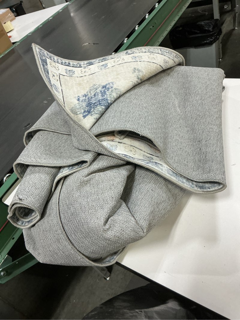 Condition photo showing As Is for EROMMY Area Rugs 5'x7' Machine Washable Area Rugs for Living Room,Ultra Soft Low Pile Faux Wool Carpets with Non-Slip Backing & Vintage Design,Stain Resistant Indoor Rug for Bedroom,Dining Room,Home 5' x 7' (Rectangular)