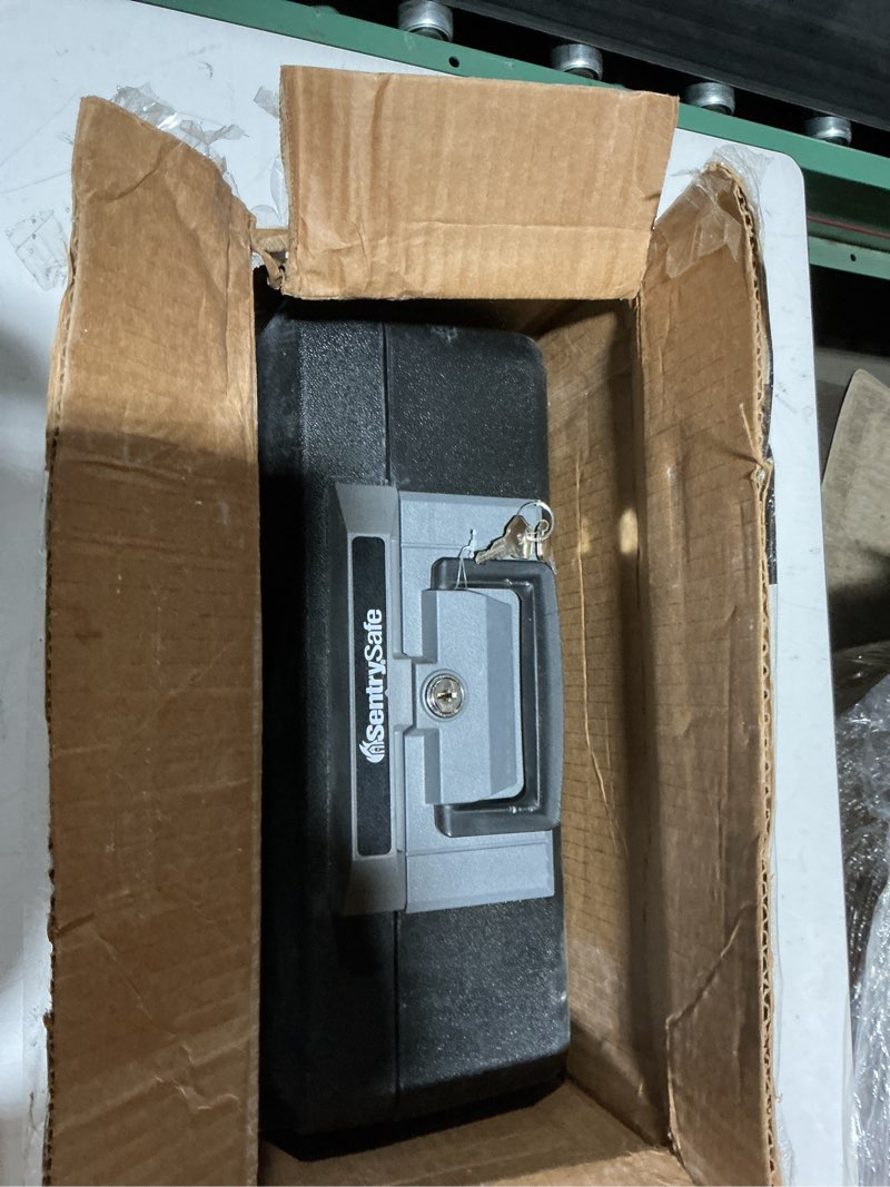 Condition photo showing Good Condition for sentrysafe fireproof safe box with key lock, chest safe with carrying handle to secure money, jewelry, documents, 0.25 cubic feet, 6.3 x 15.3 x 12.1 inches, 1160 fire resistant box 0.25 cu. ft.