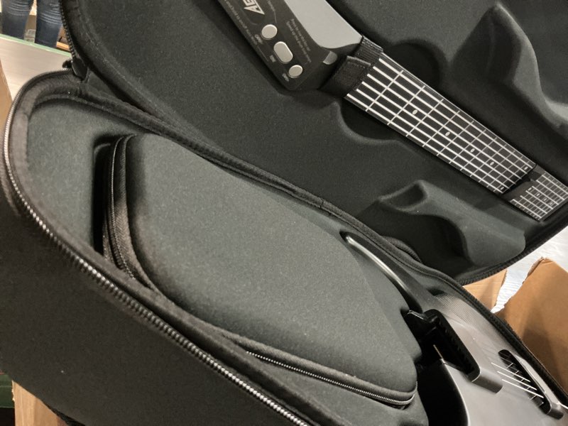 Condition photo showing As Is for AeroBand Guitar Smart Guitar With Silicone Strings, Travel Silent Guitar With Detachable Fretboard, Headphone Jack, Built-in Speaker and Drum system, Aeroband APP Play, MIDI With Bag