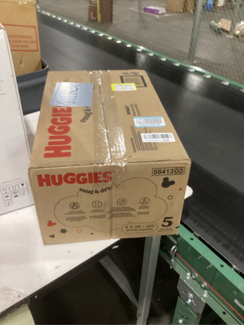 Condition photo showing New/Like New for Huggies Size 5 Diapers, Snug & Dry Baby Diapers, Size 5 (27+ lbs), 168 Count (6 Packs of 28), Packaging May Vary Size 5 168