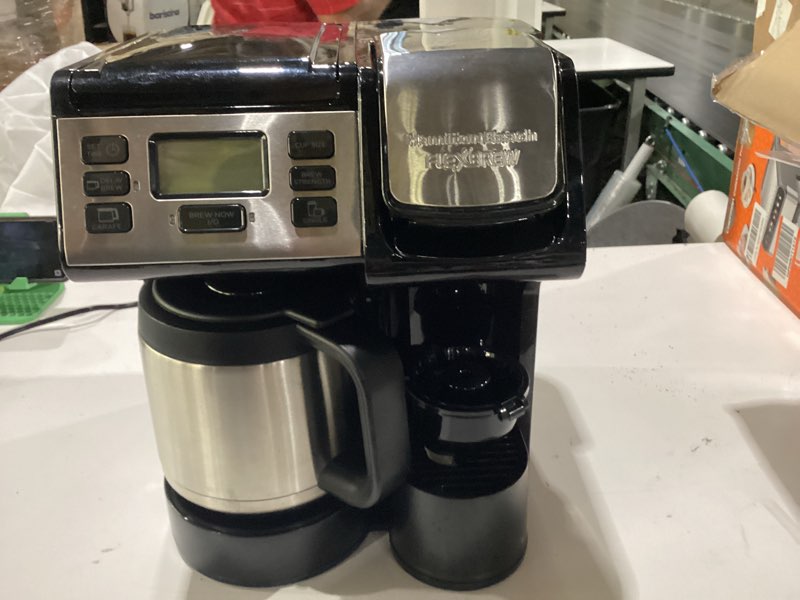 Condition photo showing As Is for damaged hamilton beach flexbrew trio 2-way coffee maker, compatible with k-cup pods or grounds, combo, single serve & full 12c thermal pot, black and stainless – fast brewing 12 cups