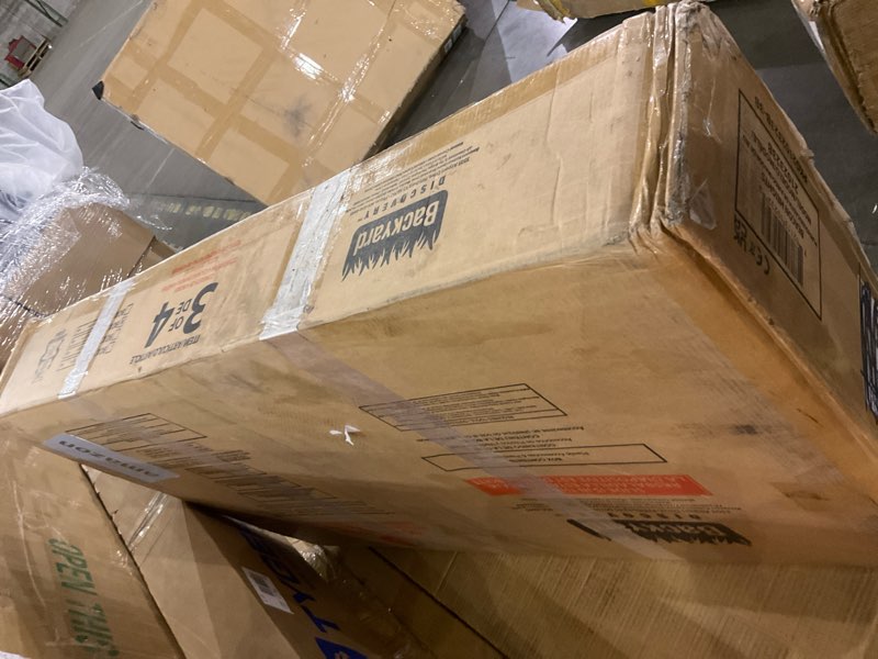 Condition photo showing As Is for Backyard Discovery Beacon Heights Elevated Cedar Wooden Kids Playhouse with Wave Slide, Play Kitchen, Wrap-Around Deck, Flat-Step Ladder, Half Door, Windows, Bell, and Growth Chart for Outdoor Play Blue