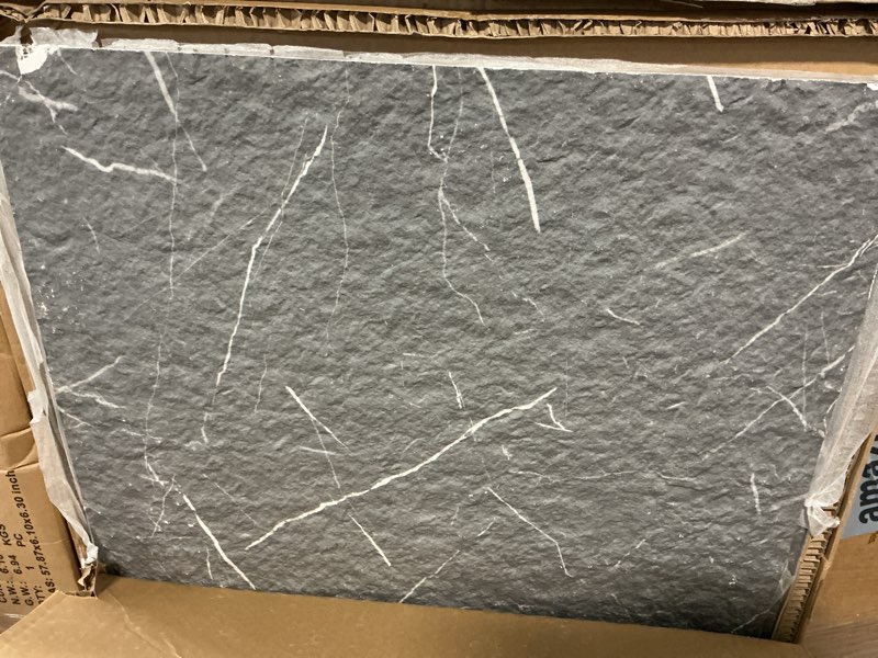 Condition photo showing As Is for 4-pack faux stone wall covering, 23.6" x 47.2" mcm modified clay material 3d wall panels, black marquina textured subway flexible stone wall tiles for home decoration, covering 31 sq. ft.