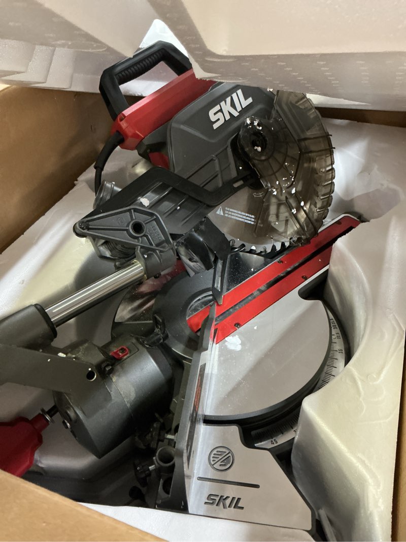 Condition photo showing As Is for skil 10" dual bevel sliding compound miter saw - ms6305-00