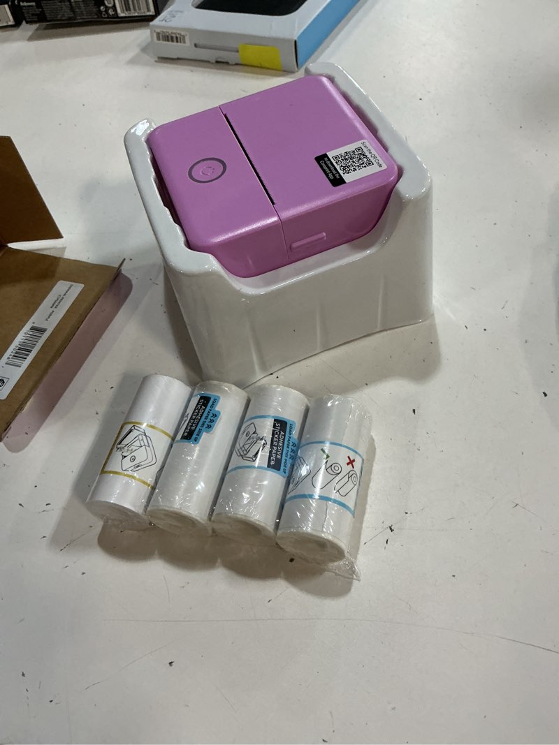 Condition photo showing As Is for wireless mini portable thermal printer label maker, paper included for android and ios phone, purple