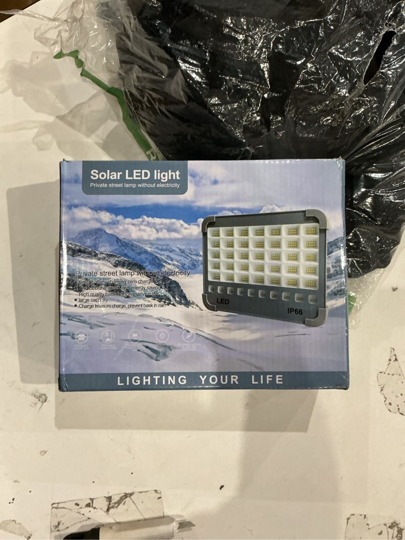Condition photo showing As Is for led work light solar & plug rechargeable, flood lights outdoor ip66 waterproof with 4 modes led for emergency, garage, camping,car repair