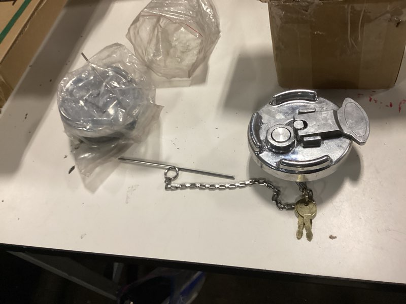 Condition photo showing New/Like New for locking aluminum lever style diesel fuel cap for peterbilt
