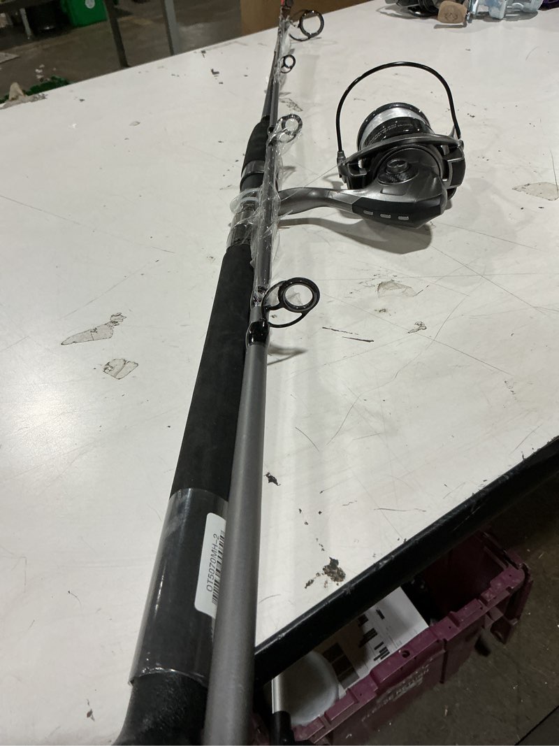Condition photo showing As Is for ozark trail grit stick fishing rod and reel spinning combo, 7-foot medium heavy action 2-piece fishing rod, size 5000 reel, left/right hand retrieve, grey with orange