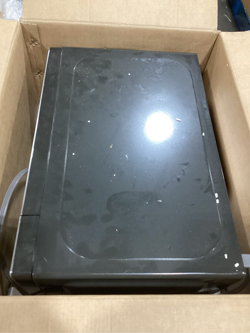 Condition photo showing As Is for GE - 0.7 Cu. Ft. Countertop Microwave with Convenience Cooking Control - Black Stainless Steel