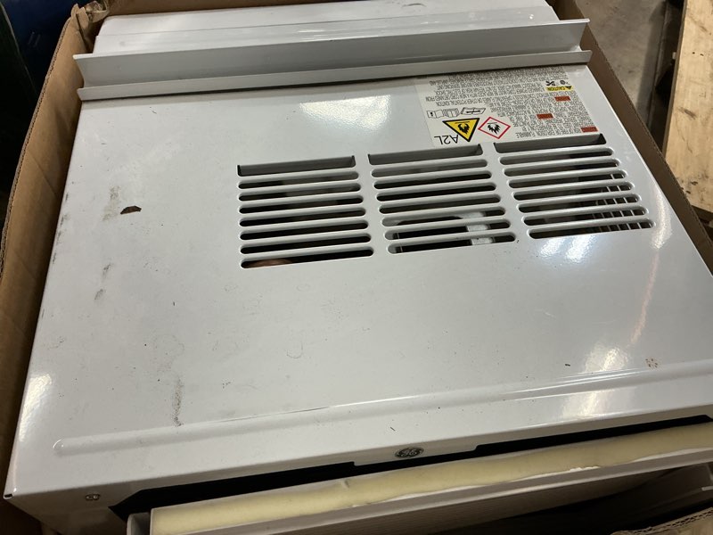 Condition photo showing As Is for ge® 12 000 btu 115volts smart window air conditioner for large rooms up to 550 sq. ft. in white