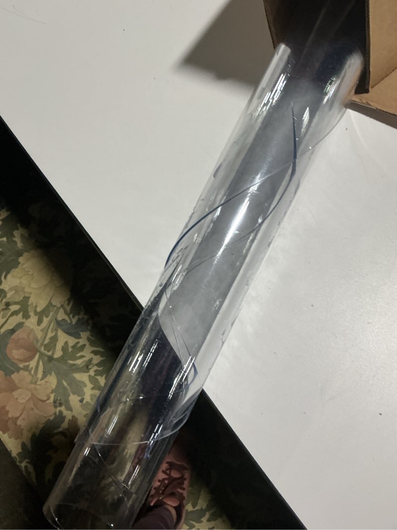 Condition photo showing As Is for Warmstar Clear Table Protector 2mm Thick, Dia.47 Inch Round Clear Table Cover Protector, Plastic Table Cover, Clear Desk Mat Desk Pad, Desk Protector Mat for Coffee Table, Writing Desk, Dining Room Clear 47" x 47"