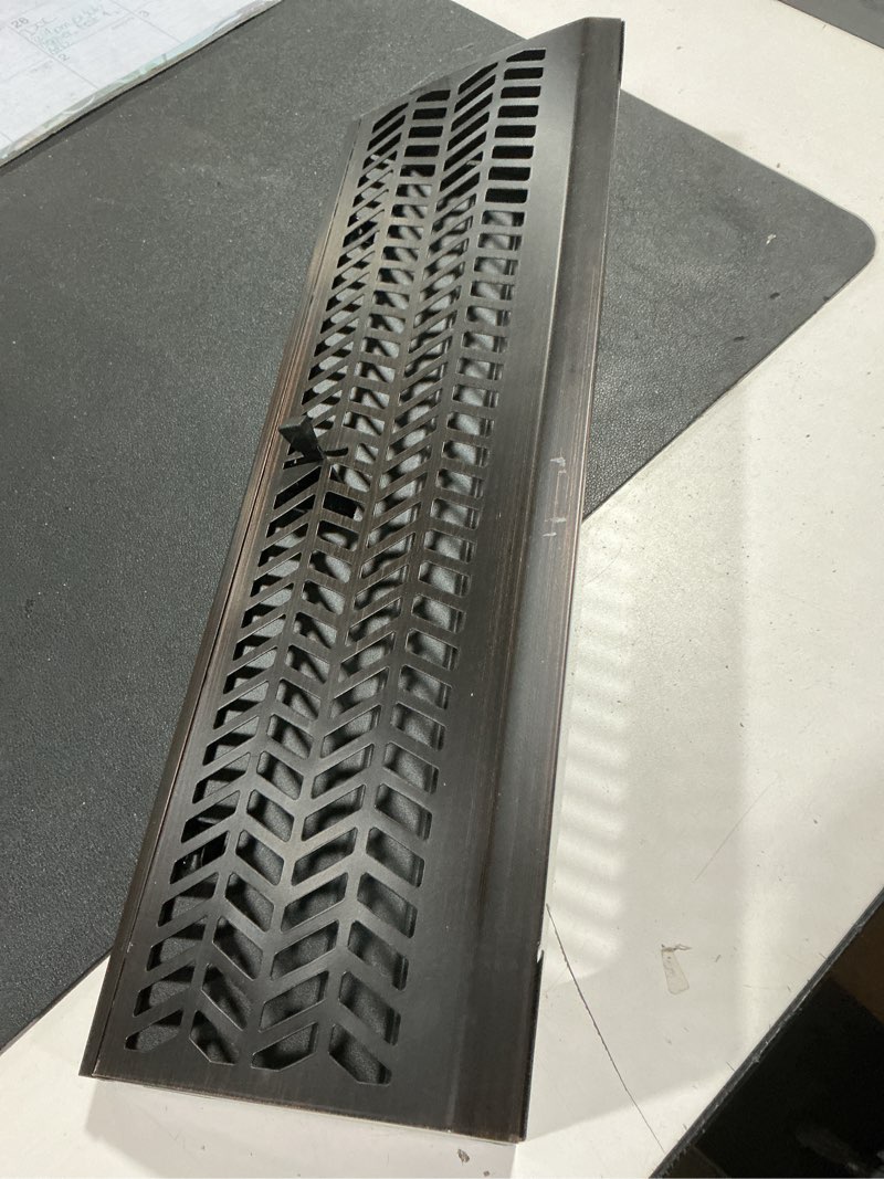 Condition photo showing Good Condition for blulu 1 pack 18 inch baseboard register vent baseboard vent covers heavy duty steel air diffuser with adjust lever for home floor wall duct openings hvac supply, chevron design, easy to install(black) 18 inch black 1