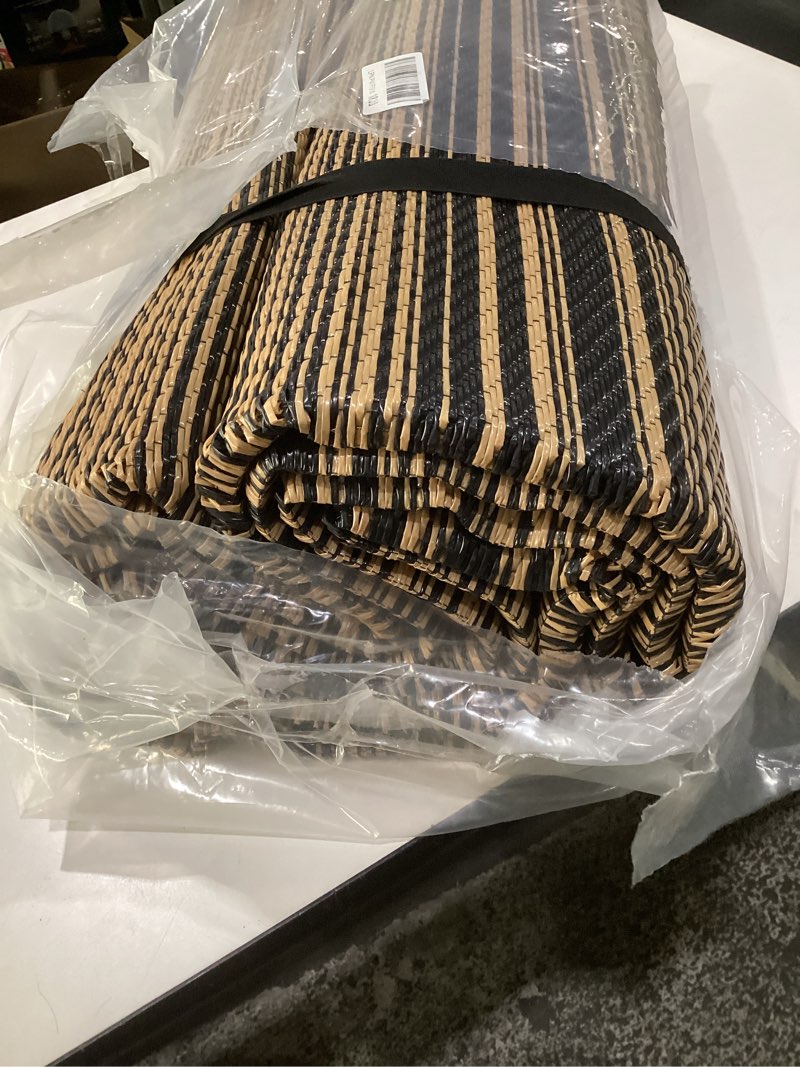 Condition photo showing As Is for (similar to stock photos, size unknown, striped)outdoor rug black and brown coloured outdoor camping rug