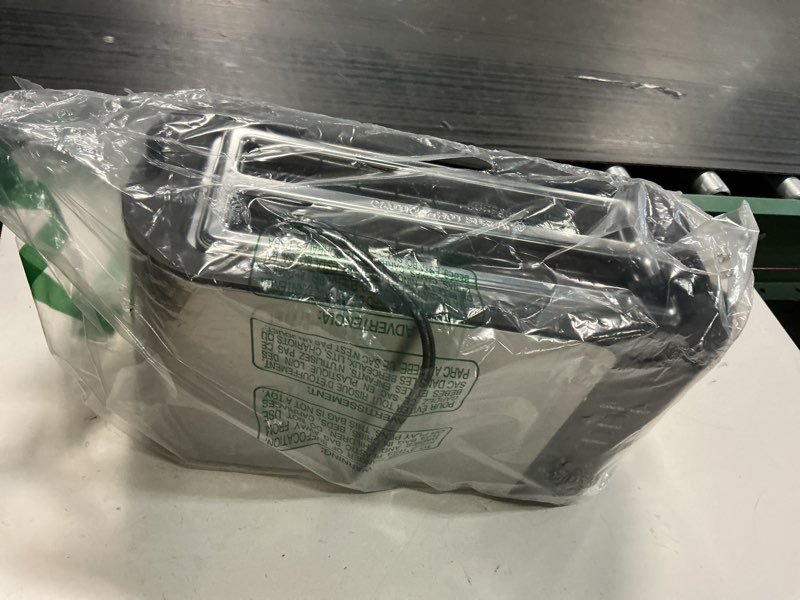 Condition photo showing As Is for elite gourmet ect-3100 4-slice long slot toaster | extra wide slots for bagels, sourdough & texas toast | 6 browning settings | reheat, defrost & cancel | built-in warming rack | stainless steel 4 slice black/stainless steel