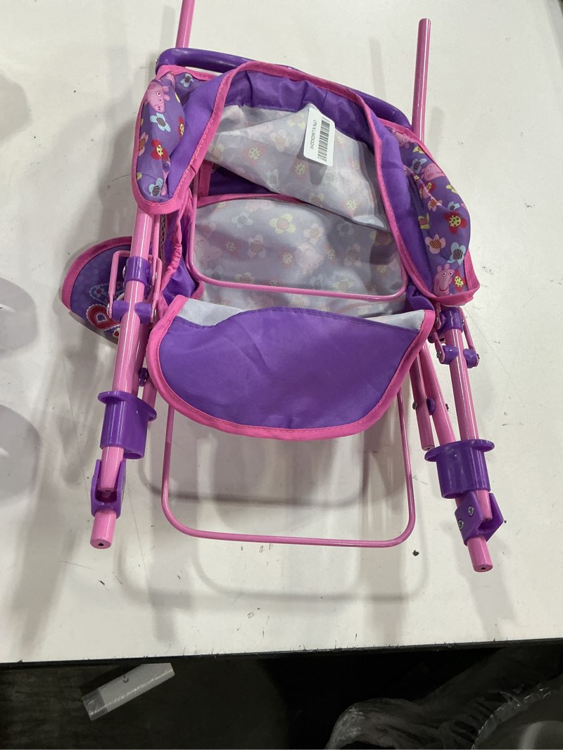 Condition photo showing As Is for Peppa Pig: Doll Twin Stroller - Purple, Pink, Flowers - Seats 2 Dolls Up to 18", Foldable Design, Retractable Canopy, Adjustable Seats, Kid Toy Age 3+