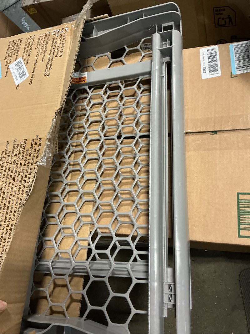 Condition photo showing As Is for regalo safety 28"-42" extra wide expandable baby gate for doorways & bottom of stairs, pressure mounted safety gate for babies, toddlers & pets, tested & safe for 30 years, american designed and owned plastic