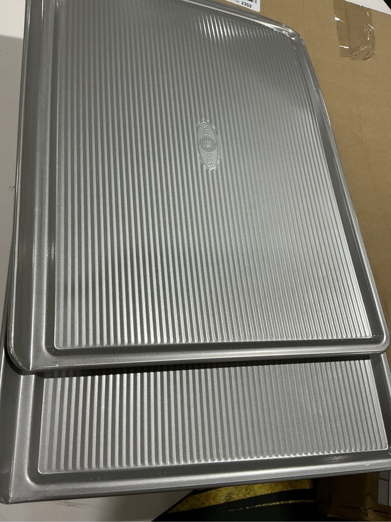 Condition photo showing As Is for USA Pan Bakeware Cookie Sheet, Warp Resistant Nonstick Baking Pan, Made in the USA from Aluminized Steel, Large Set of 2 Large - Set of 2
