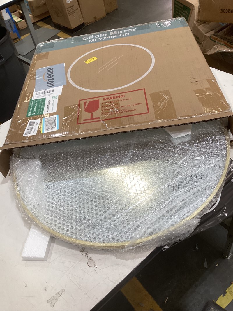 Condition photo showing Good Condition for this packaging represents a 24-inch round wall mirror with a gold-colored frame, likely designed for bathroom vanity use