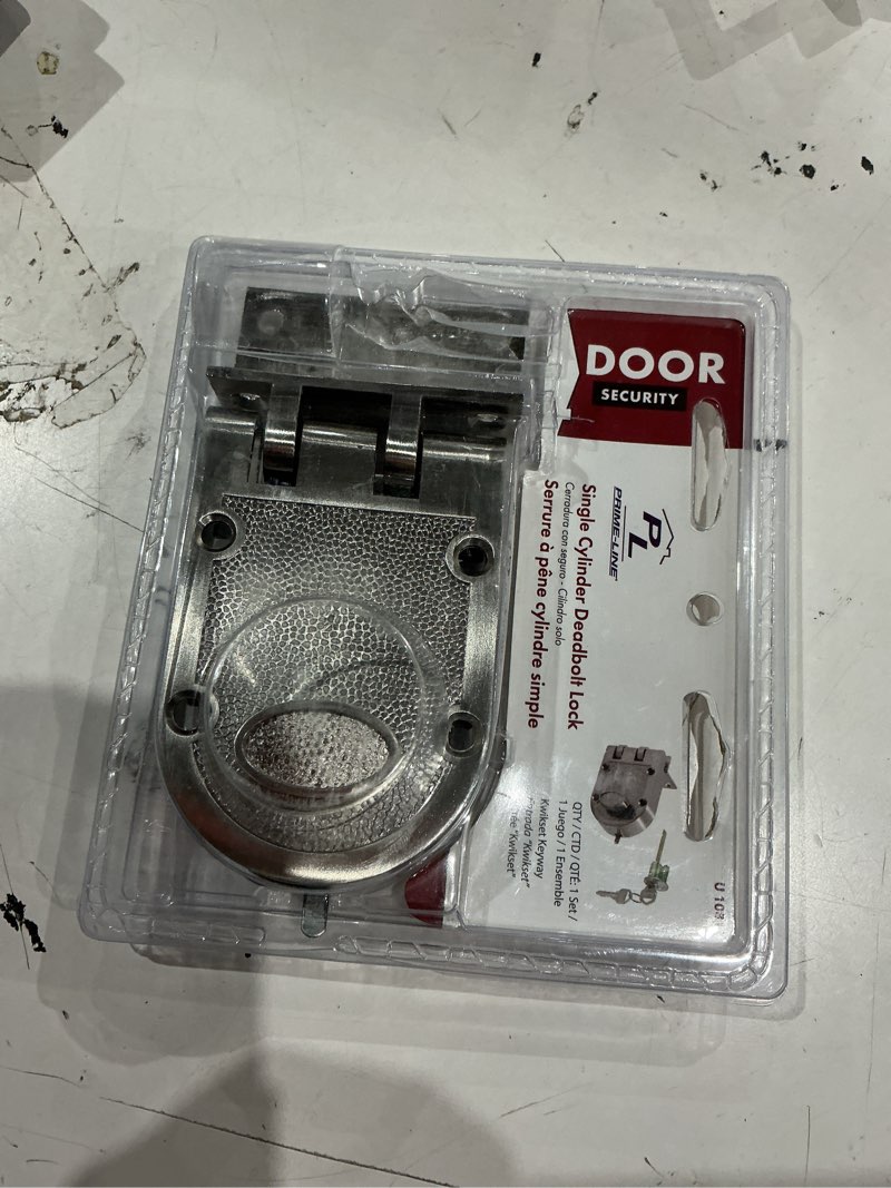 Condition photo showing As Is for incomplete. missing keys. prime-line defender security satin nickel steel single cylinder lock