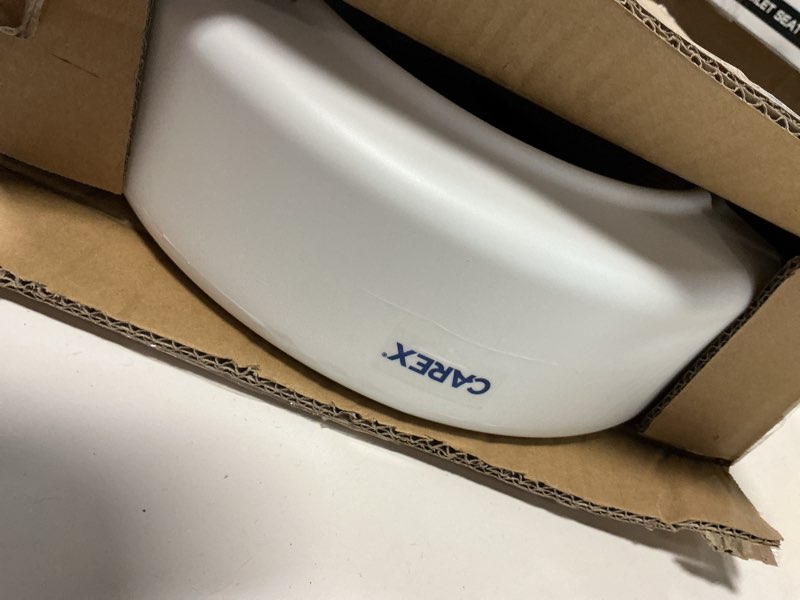 Condition photo showing As Is for Compass Raised Toilet Seat with Arms, Elongated Toilets, 3.5 Inch High, Elevated Toilet Riser with Removable Padded Handles, Easy On and Off, Support 250 lbs, White