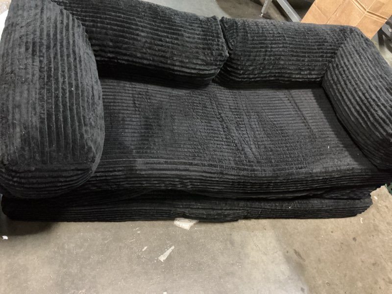 Condition photo showing As Is for unsofa stationary loveseat in black