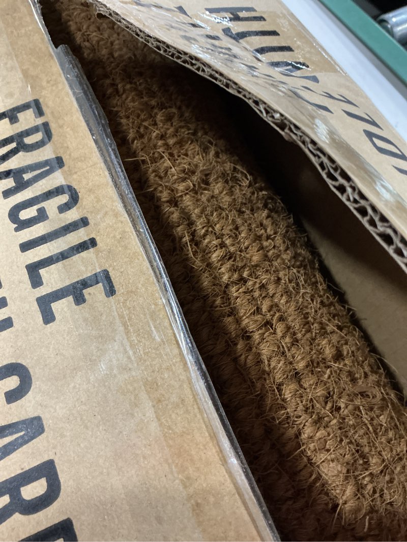 Condition photo showing As Is for kempf 1" thick natural woven coco coir doormat, 18" x 30", heavy-duty coconut fiber scraper mat for front door, entryway & porch 1'6" x 2'6" (rectangular)