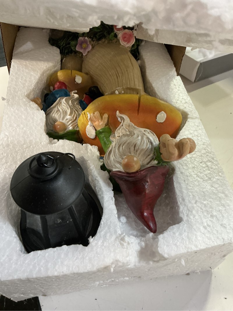 Condition photo showing New/Like New for garden gnome statue, large funny gnome figurine climbing on mushroom and holding a solar led lantern resin ornament for patio yard lawn porch outdoor decor