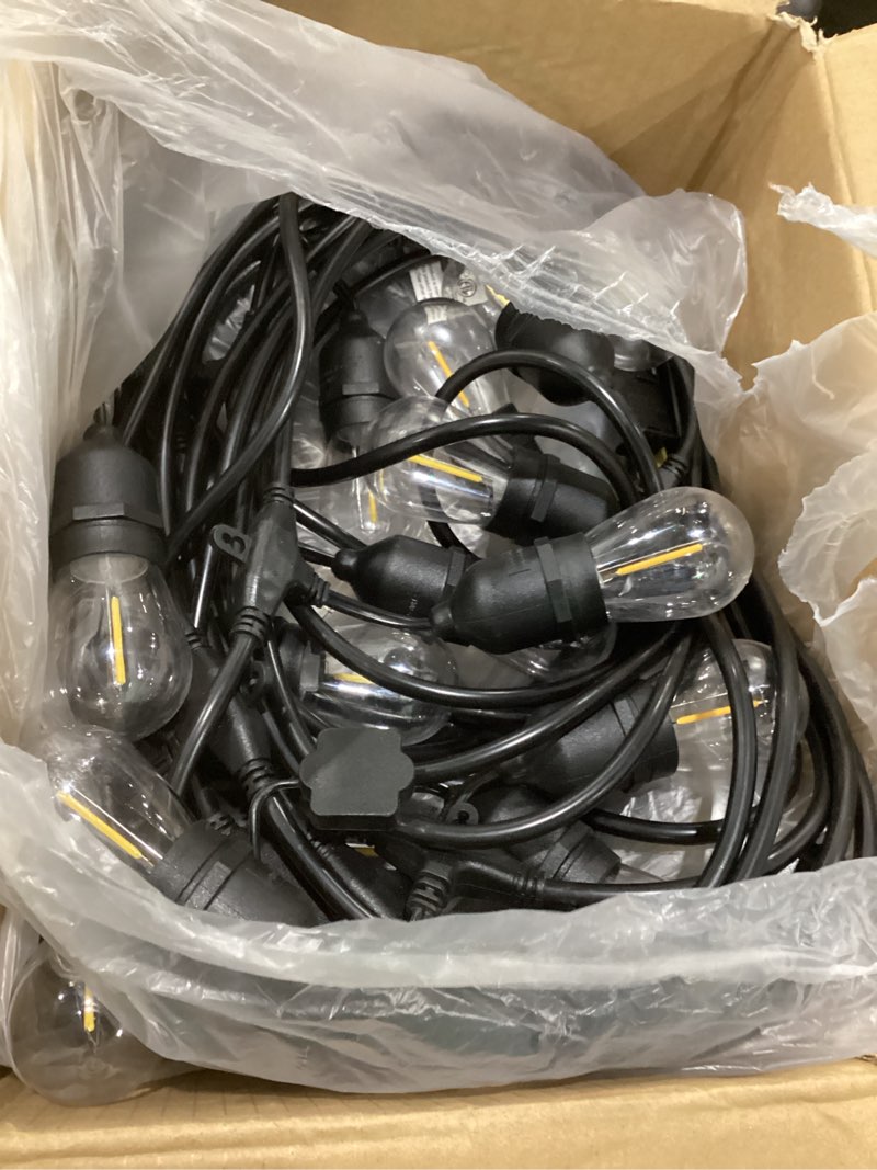 Condition photo showing As Is for lakumu outdoor string lights 96ft(48×2), commercial grade heavy duty patio lights with dimmable s14 shatterproof led bulbs, linkable waterproof bistro lights for outside deck backyard cafe market black-2700k 96ft(48ft*2), not tested
