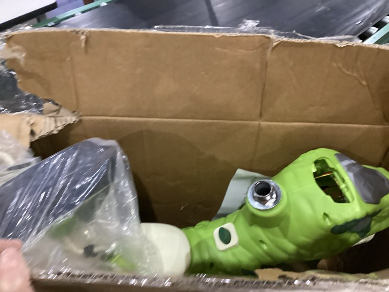 Condition photo showing As Is for dinosaur tricycle
