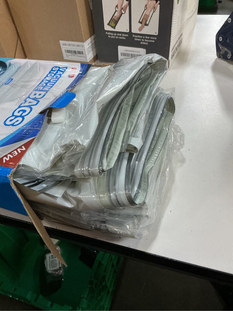 Condition photo showing As Is for taili 8 pack vacuum storage bags for comforter and blankets, jumbo vacuum seal bags for bedding 40x31 inch, space saver bags for clothes, pillows, saving more closet space 8 jumbo cream