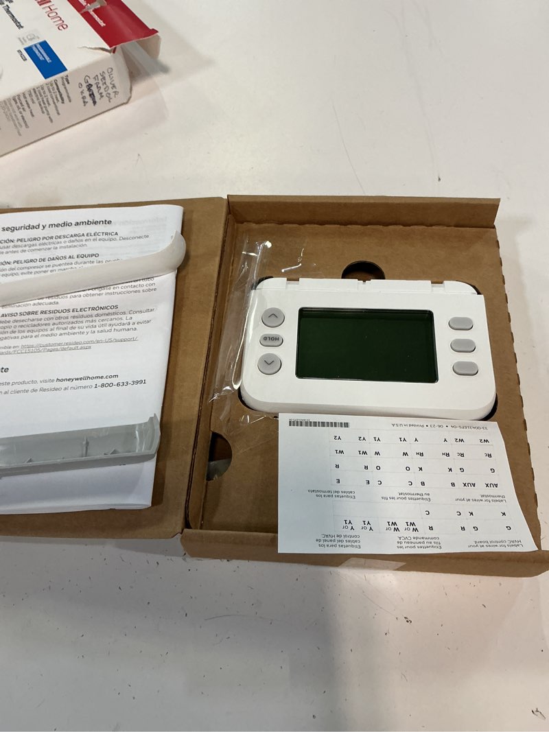 Condition photo showing As Is for honeywell home x2p heating and cooling push button programmable thermostat