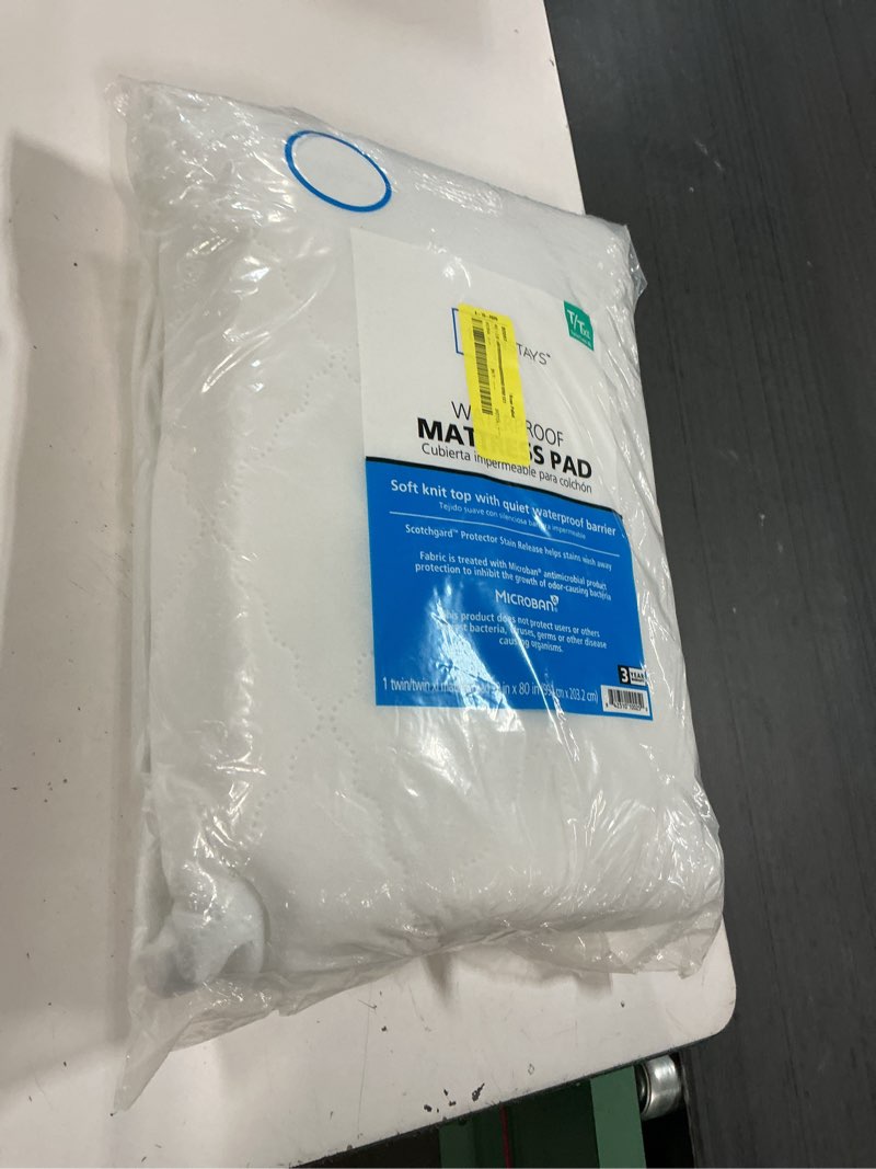 Condition photo showing As Is for mainstays waterproof mattress pad, twin/twin-xl, 39 in x 80 in