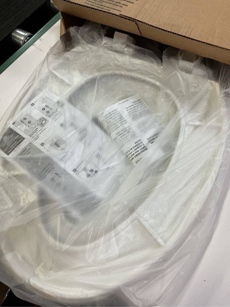 Condition photo showing As Is for Mayfair Little2Big? Elongated Plastic Toilet Seat in White with STA-TITE? Seat Fastening System? and Whisper•Close? Hinge