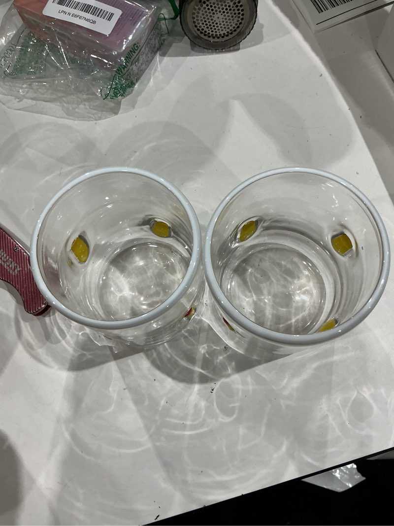 Condition photo showing As Is for juice glass