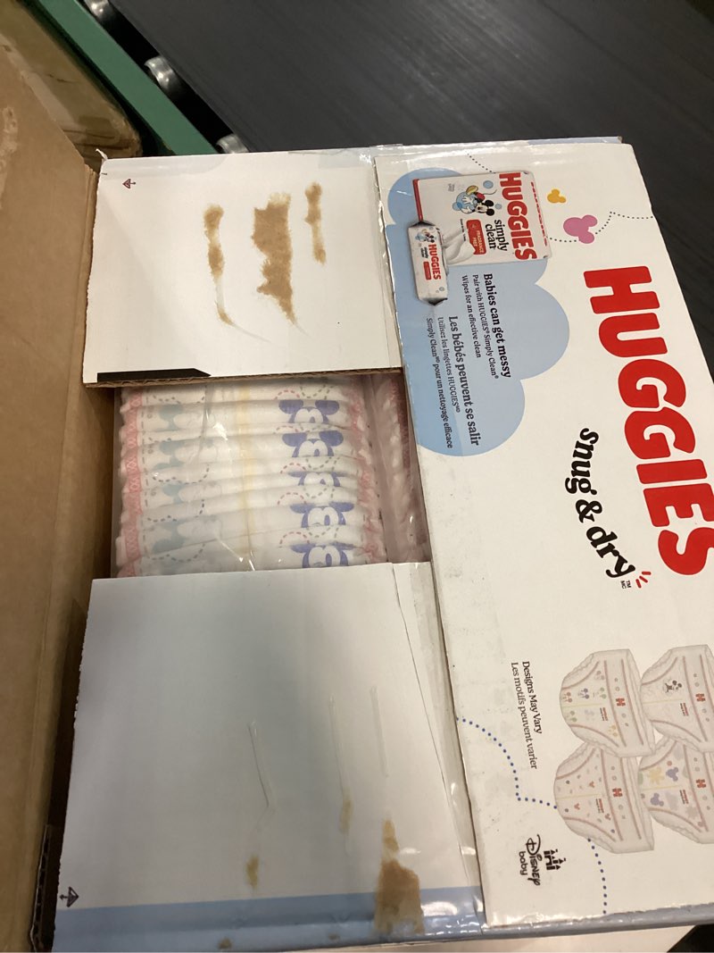 Condition photo showing New/Like New for Huggies Size 1 Diapers, Snug & Dry Newborn Diapers, Size 1 (8-14 lbs), 128 Count, Packaging May Vary Size 1 128