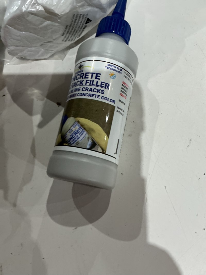 Condition photo showing Good Condition for bluestar flexible concrete hairline crack filler (light gray), diy - no special tools needed. fill small cracks in concrete driveways, sidewalks and patios.