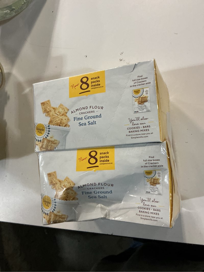 Condition photo showing New/Like New for (by 05-06-2026)simple mills almond flour crackers snack packs, sea salt, gluten free, flax seed, sunflower seeds, corn free, good for snacks, 6.5 oz, pack of 2 (8 bags per box) fine ground sea salt 6.5 ounce (pack of 2)